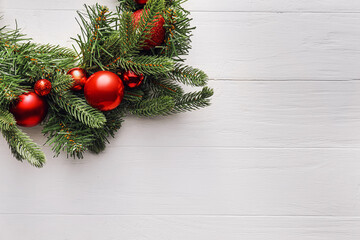 Fototapeta na wymiar Beautiful Christmas wreath on white wooden background