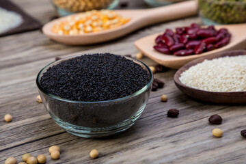 Dry sweet basil seed in  bowl. Sweet basil seed in small bowl.  Black sesame in bowl. Dried black sesame seeds in the plate.