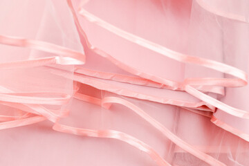 Wedding dress detail. Pink wedding dress frills close up.