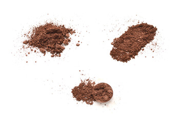 Makeup cosmetics. Eyeshadow in brown color crushed palette, colorful eye shadow powder on white background