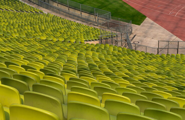 Naklejka premium endless rows of enpty chairs in a stadium