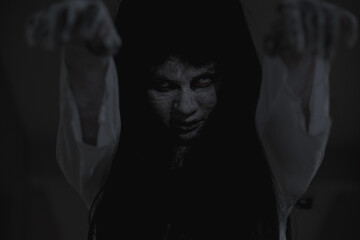 Horror woman ghost creepy stand lift 2 hands on the house, halloween day concept