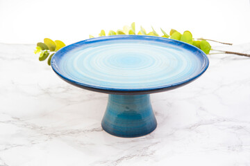 Fototapeta na wymiar colorful handmade ceramic plates on marble table