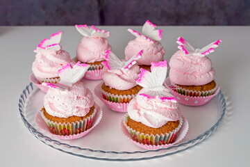Pink cupcakes with butterfly decoration
