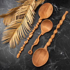 handmade wooden spoon on black marble