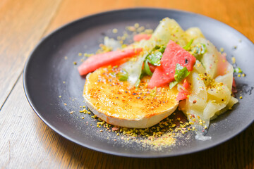 Watermelon and cucumber cheese salad with mint and melon. Watermelon summer menu, seasonal meal concept.