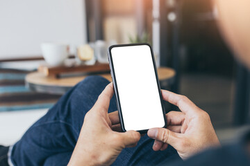 cell phone mockup blank white screen.woman hand holding texting using mobile on desk at coffee shop.background empty space for advertise.work people contact marketing business,technology