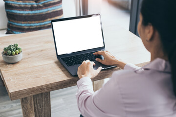 computer mockup blank screen.hand woman work using laptop with white background for advertising,contact business search information on desk at coffee shop.marketing and creative design