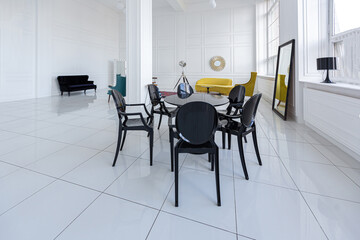 modern fashionable futuristic interior design of a spacious white hall with black and yellow furniture