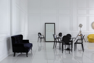 modern fashionable futuristic interior design of a spacious white hall with black and yellow furniture