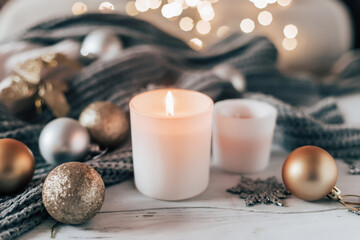 New Year and Christmas decor with garland and candles.