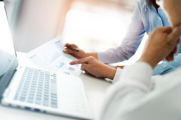 Senior businessman helping new employee intern in company.