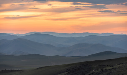 Steppe in Mongolia with Sunset and Orange Clouds