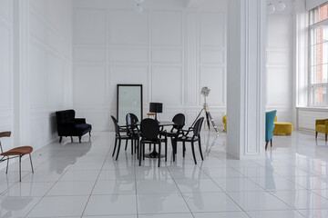 modern fashionable futuristic interior design of a spacious white hall with black and yellow...