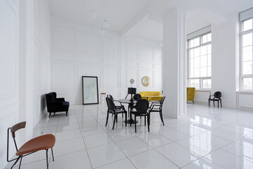 modern fashionable futuristic interior design of a spacious white hall with black and yellow furniture
