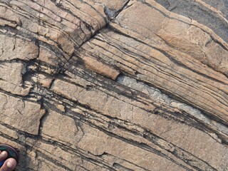 Natural background of rock in riverside india.  Stones texture and background. Rock texture. Rock fragment. Abstract background. A fragment of rock. 