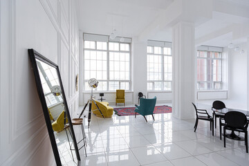 modern fashionable futuristic interior design of a spacious white hall with black and yellow furniture