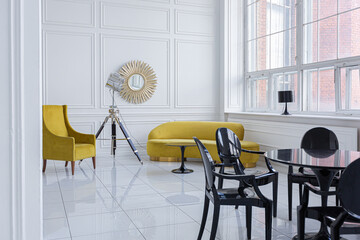 modern fashionable futuristic interior design of a spacious white hall with black and yellow furniture