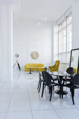 modern fashionable futuristic interior design of a spacious white hall with black and yellow furniture