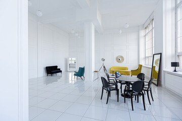 modern fashionable futuristic interior design of a spacious white hall with black and yellow furniture