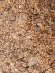 Natural background of rock in riverside india.  Stones texture and background. Rock texture. Rock fragment. Abstract background. A fragment of rock. 