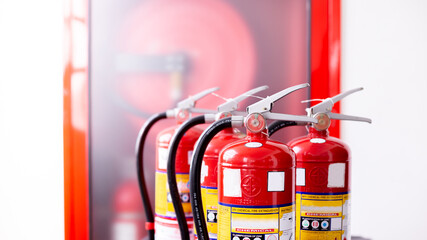 Red tank of fire extinguisher.