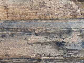 Natural background of rock in riverside india.  Stones texture and background. Rock texture. Rock fragment. Abstract background. A fragment of rock. 