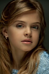 Portrait of a beautiful blonde teenager girl with skillful makeup