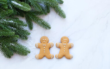 Christmas and New Year holiday background. gingerbread mens and fir tree. winter festive season. flat lay. copy space