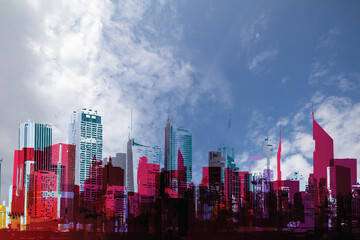 Fototapeta na wymiar Generic abstract silhouetted urban city skyline set against a blue cloudy daytime sky