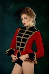 Beautiful sexy girl in a hussar fancy dress on a black background