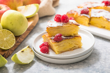 Piece of fresh baked homemade layered apple pie.