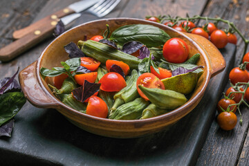 Traditional healthy organic Turkish food Okra with tomato  and olive oil. Ready to eat.