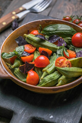 Traditional healthy organic Turkish food Okra with tomato  and olive oil. Ready to eat.
