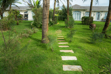 Stone paved path to the villa at tropical resort