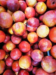 plums on a market stall