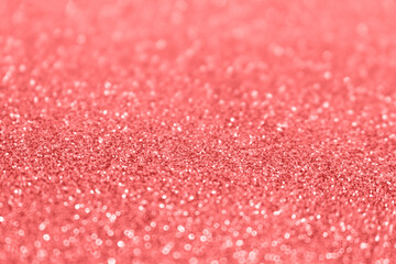 Red glittering blur background. Festive defocused backdrop. Shiny bokeh.