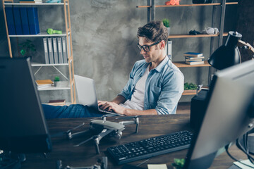 Portrait of his he nice attractive focused skilled smart guy geek expert working remotely typing coding web development home-based safety at modern industrial home office work place station