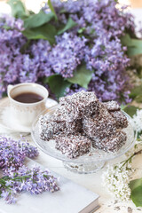 Chocolate & coconut cake with lilac flowers