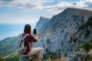 woman hiker enjoy the view at sunset mountain peak cliff