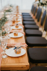 Beautiful wedding table setting decorated with flowers and candles