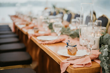 Beautiful wedding table setting decorated with flowers and candles