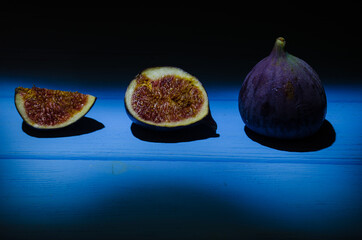 Still life with figs on the wooden background