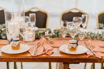 Beautiful wedding table setting decorated with flowers and candles