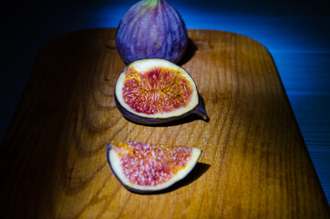 Still life with figs on the wooden background