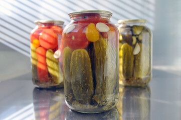Home canning of vegetables from a backyard garden. Processing tomato harvest from a home garden.