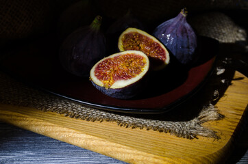 Still life with figs on the wooden background