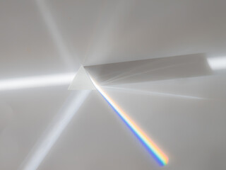 Scattering of a ray of sunlight (white light) through a prism creating refraction, reflection and...