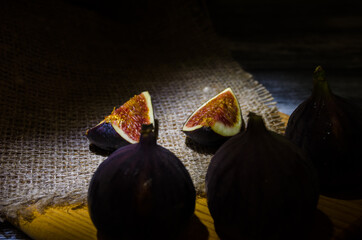 Still life with figs on the wooden background