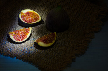 Still life with figs on the wooden background